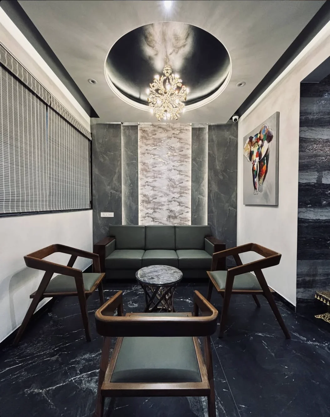 Hotel lounge with chandelier and marble flooring